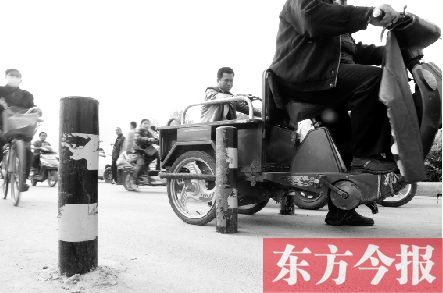 慢車(chē)道上豎隔離樁 真是“慢”車(chē)道