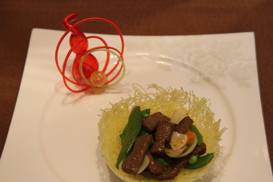 雀巢爆羊柳。 花惠生 供圖